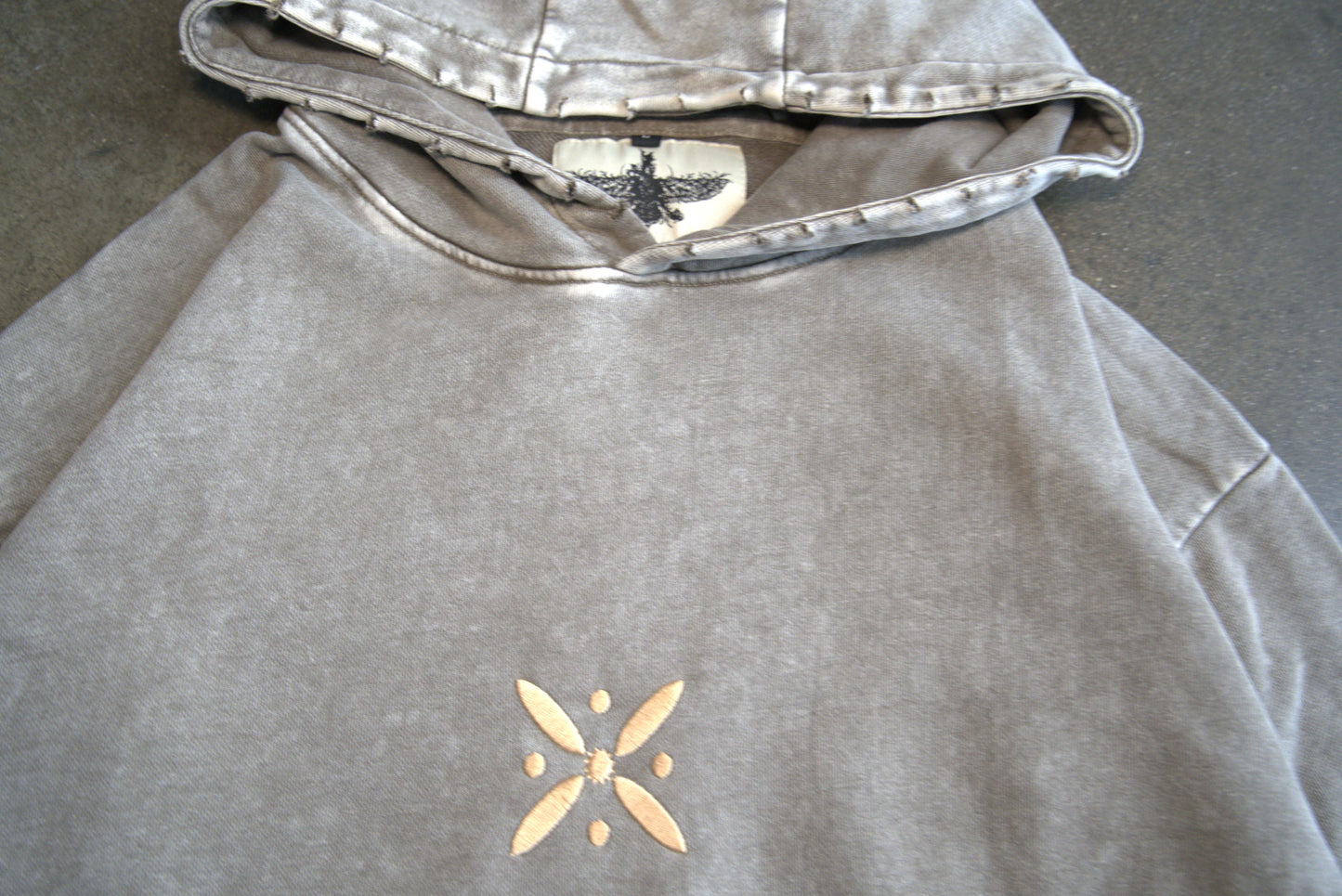 Persian diaspora streetwear hoodie in grey with golden kaviani design