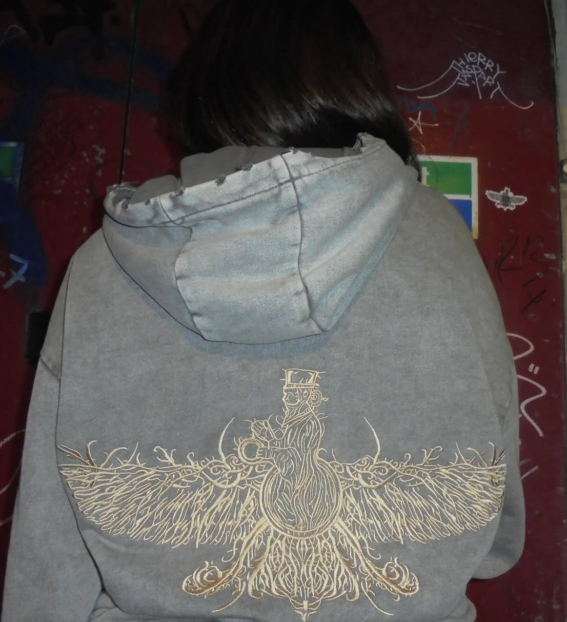 Detailed gold Farvahar embroidery close up