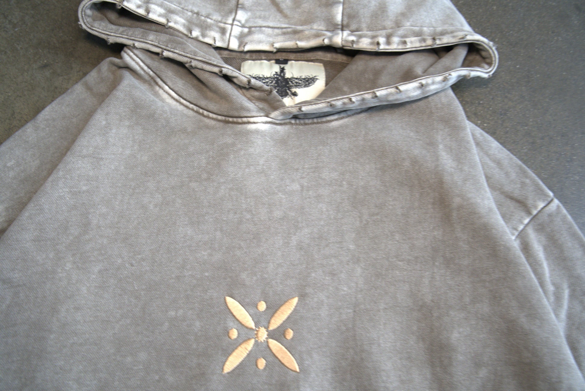 Persian diaspora streetwear hoodie in grey with golden kaviani design