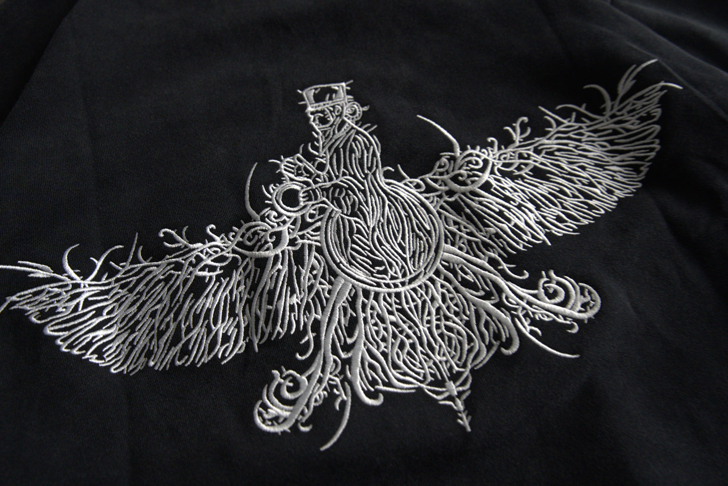 100,000 stitch white Farvahar embroidery on black hoodie