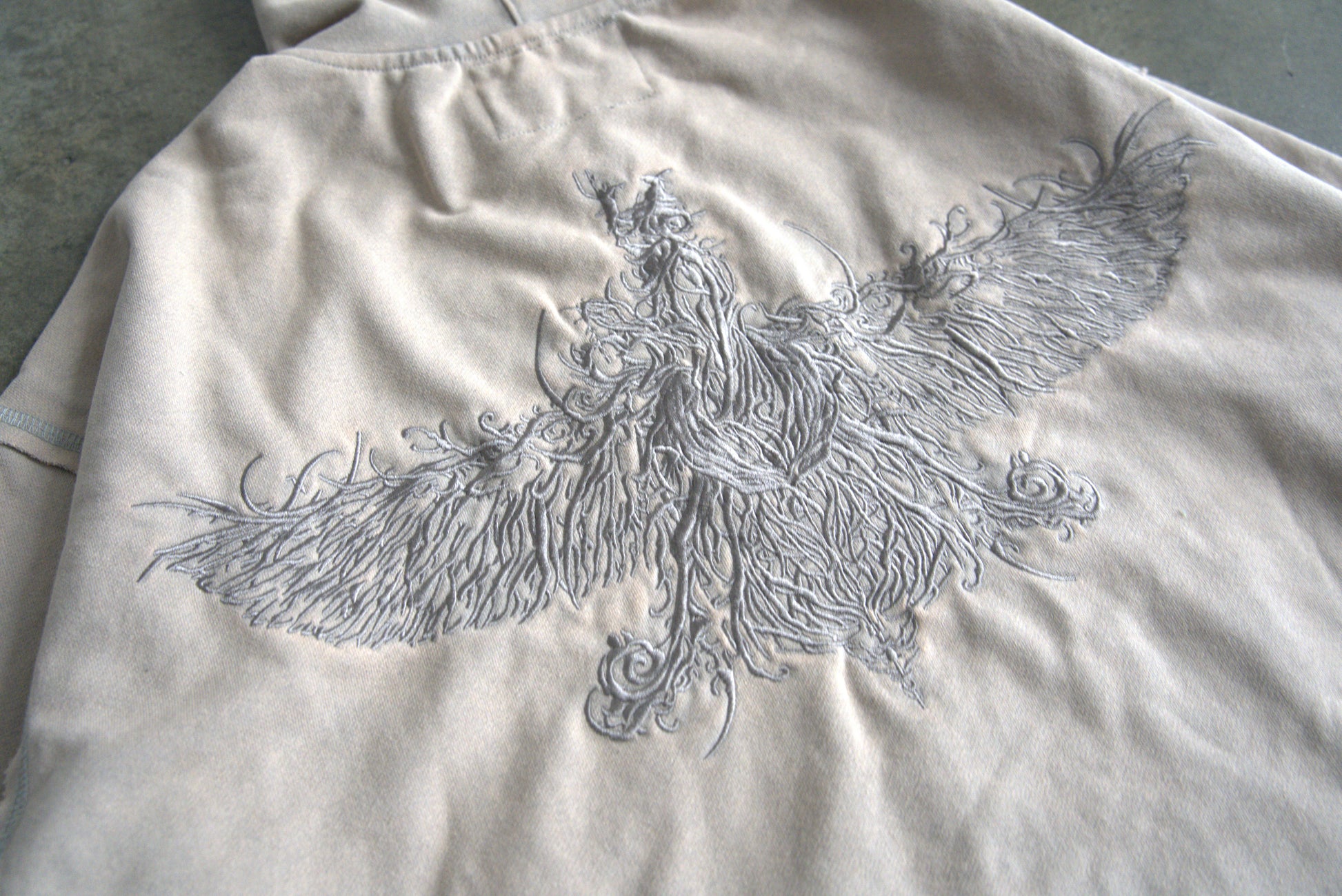 Farvahar embroidery on back of Persian hoodie