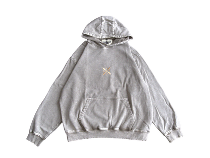 Gold Standard of Kaveh embroidery on front of hoodie